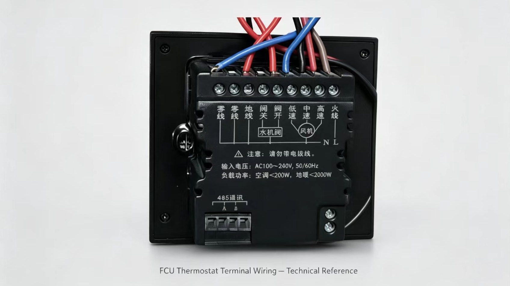 Close-up of water-system fan coil thermostat wiring on the terminal block, showing real field connections for troubleshooting.